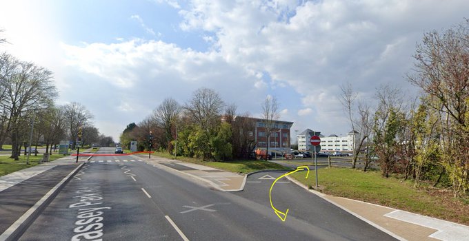 Streetview image showing footpath and cycle lane abruptly ending, and a more obvious route via a carpark